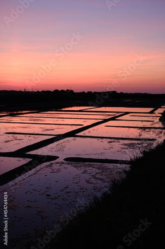 A nice sunset in the salt marshes of Guerande. Summer 2021, France.