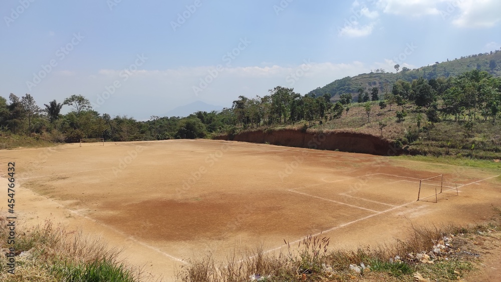 photo of a very wide football field in the Cikancung hills area