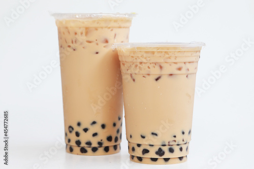 Two cups big and small Iced milk tea with boba bubble Taiwan Style on white backgrond, Isolated fresh ice sweet drink
