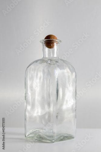 clear glass bottle, with round cap