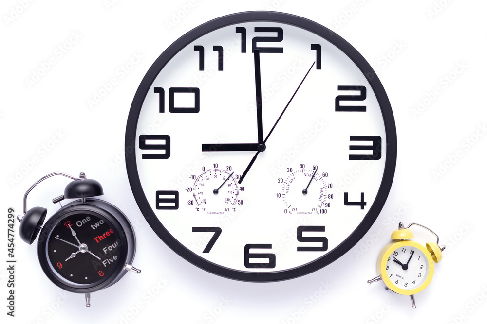 Wall clock isolated at white background. Office alarm clock Wall clock isolated at white background. Office alarm clock