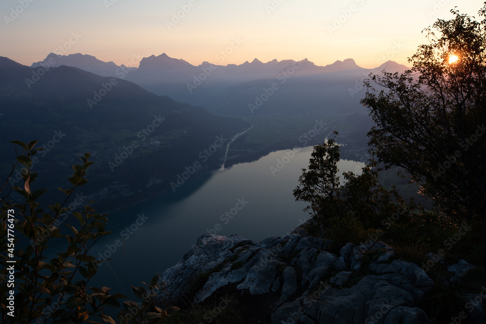 Amazing view over Lake Walen in the Canton Glarus, Switzerland. Wonderful sunset and sunrise in the swiss alps. This is a great place to hike and enjoy the beautiful nature in Switzerland.