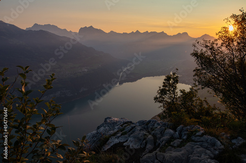 Amazing view over Lake Walen in the Canton Glarus  Switzerland. Wonderful sunset and sunrise in the swiss alps. This is a great place to hike and enjoy the beautiful nature in Switzerland.