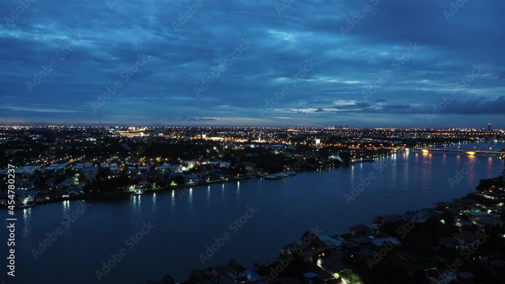Cityscape of Bangkok. Bird eye view of Chao Phraya river.Thailand. Time lapse from dawn to night. Cityscape of Bangkok. Bird eye view of Chao Phraya river.Thailand. Time lapse from dawn to night.