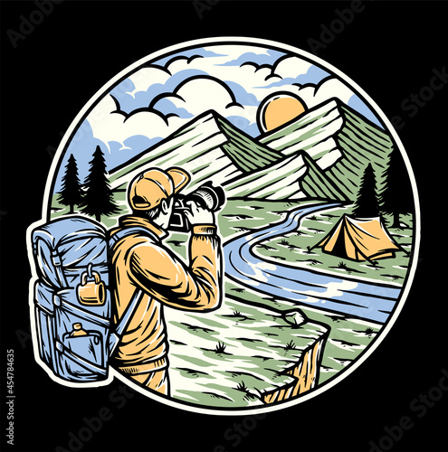 Hiker holding camera and taking pictures of mountain