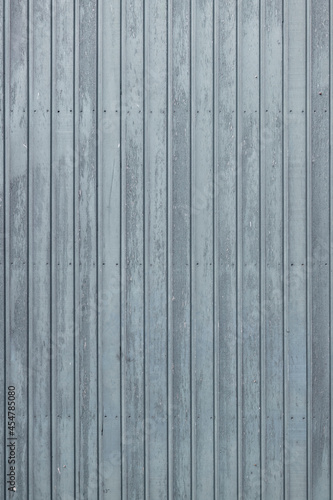 Standing photo of vertical gray-blue wooden planks