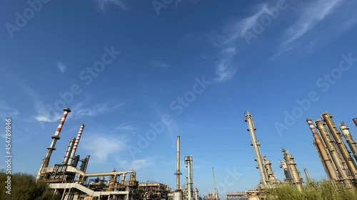 Dolly shot of the Oil Refinery of Sarroch in Cagliari, Sardinia, Italy. Wide shot. photo