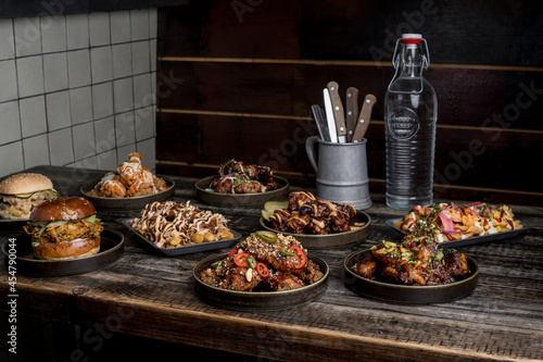 Served table with tasty fast food in restaurant