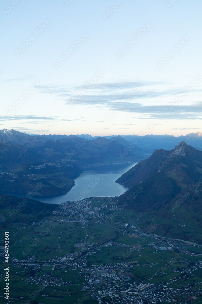 Amazing view to the Lake Lucerne at an epic sunrise in the morning of a beautiful day. Drink a beer at the restaurant at the peak of this mountain called Mythen and watch the birds fly.