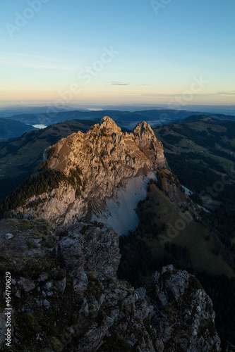 Amazing view to the Lake Lucerne at an epic sunrise in the morning of a beautiful day. Drink a beer at the restaurant at the peak of this mountain called Mythen and watch the birds fly. © Philip