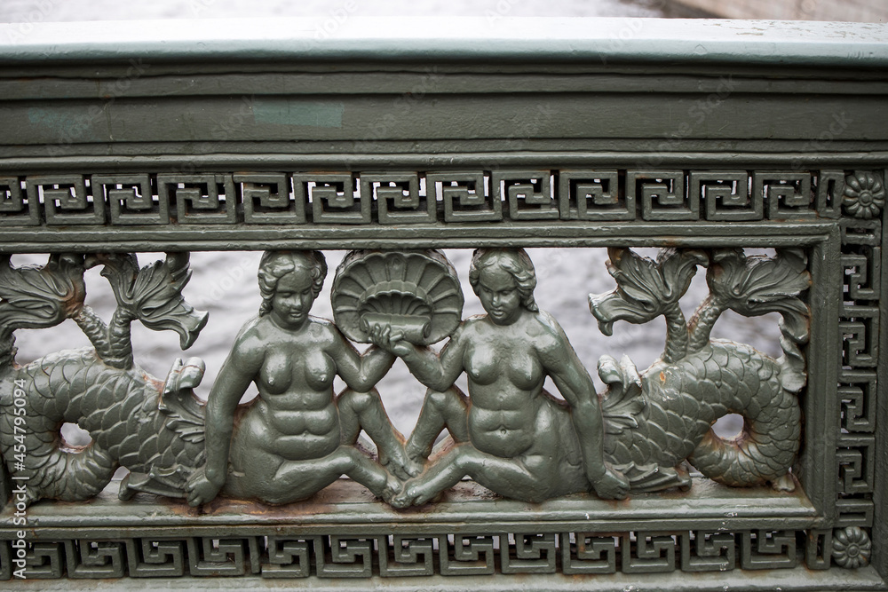 A fragment of the fence of Anichkov bridge with the mermaids.