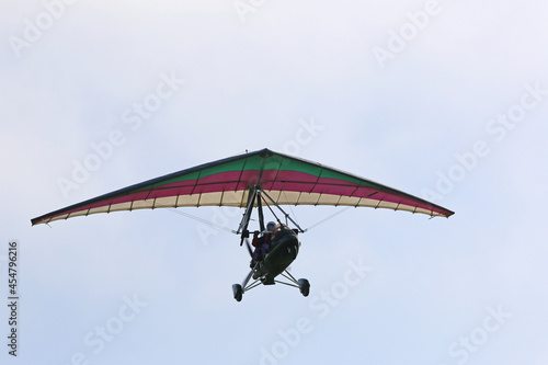 Canvas-taulu Ultralight airplane flying in a blue sky