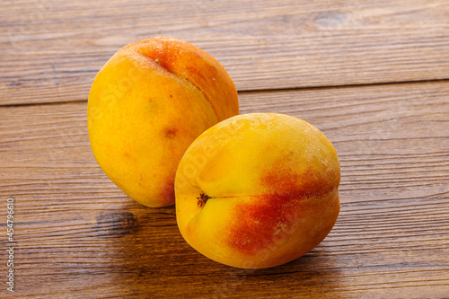Two Sweet ripe tasty peaches