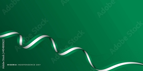 Quadro su tela Flying Nigeria ribbon flag vector illustration with green background