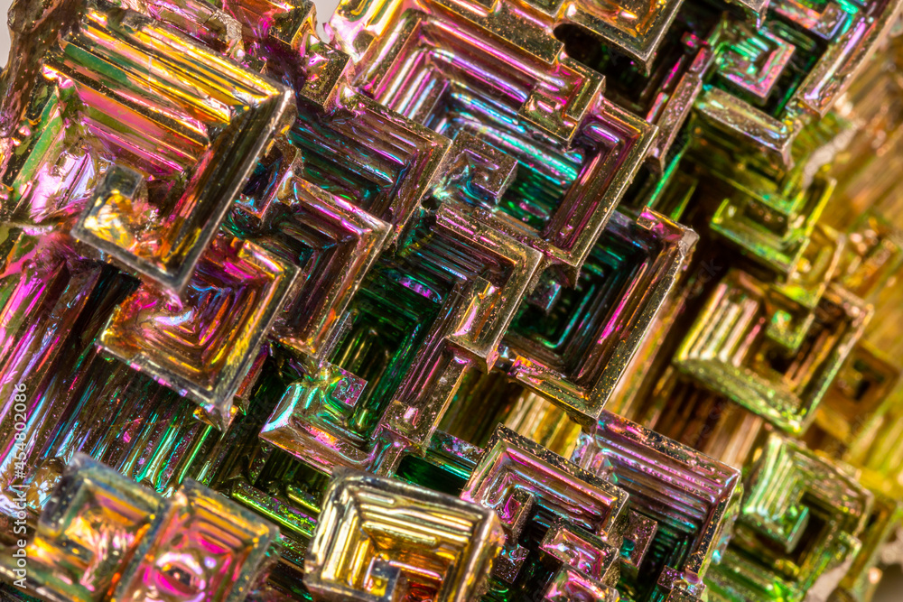 Macro of the mineral bismuth stone on a white background