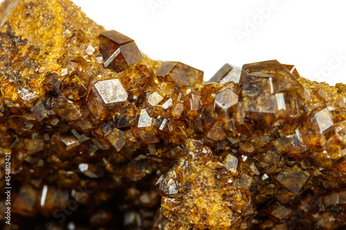 Macro mineral stone Garnet  Green Garnet  Epidote Grossular in the rock on a white background