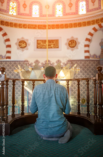 Bearded man praying in the mosque