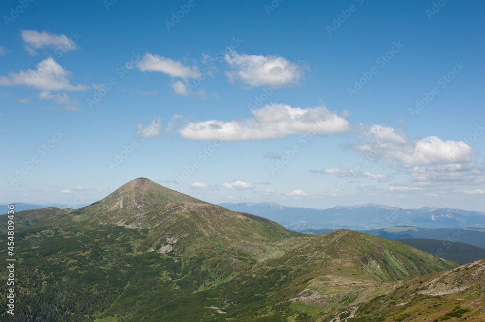 panorama of mountain ranges and cloudy sky background