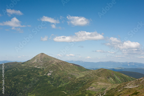 panorama of mountain ranges and cloudy sky background © Yurii Klymko