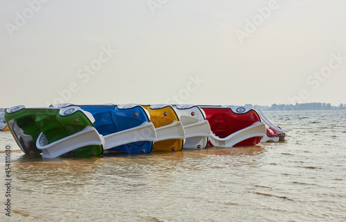  Сolorful catamarans in the form of a car on Lake Svityaz (Svityaz, Shatsk National Natural Park, Ukraine). photo