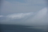 A thick layer of fog coming in over the waters of the San Francisco bay