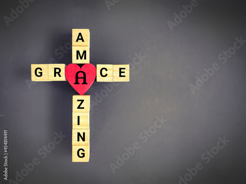 Christianity Concept -  Text of amazing grace on cross shaped background. Stock photo.