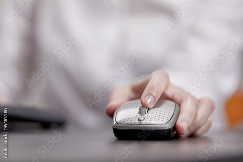 close up of businesswoman using computer mouse