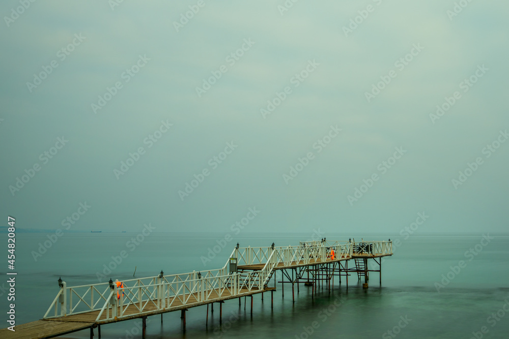 jetty with wooden floors on the shores of the Marmara Sea at Tekirdag Beach in Turkey