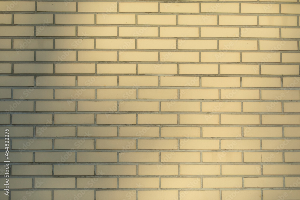 Obraz premium Beige brick wall. Texture of bricks in natural light.