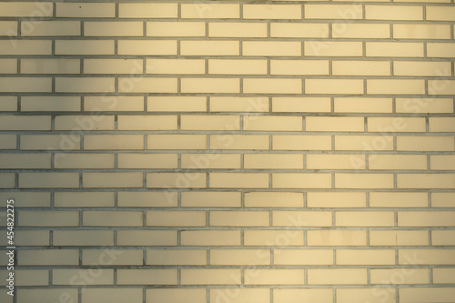 Beige brick wall. Texture of bricks in natural light.