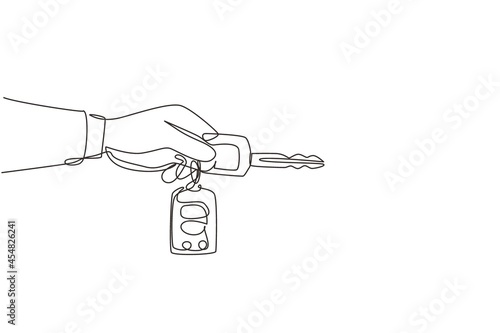Single one line drawing hand holding car key and alarm system. Male hand holding car key with alarm keychain. Hand of car salesman manager holding key. Continuous line draw design graphic vector
