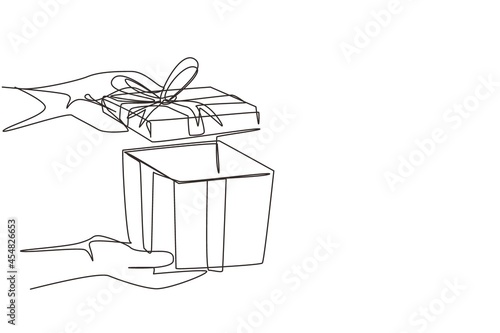 Continuous one line drawing woman holding gift box on holiday. Opened decorative box with confetti. Present package with bursting elements, surprise inside. Single line draw design vector graphic
