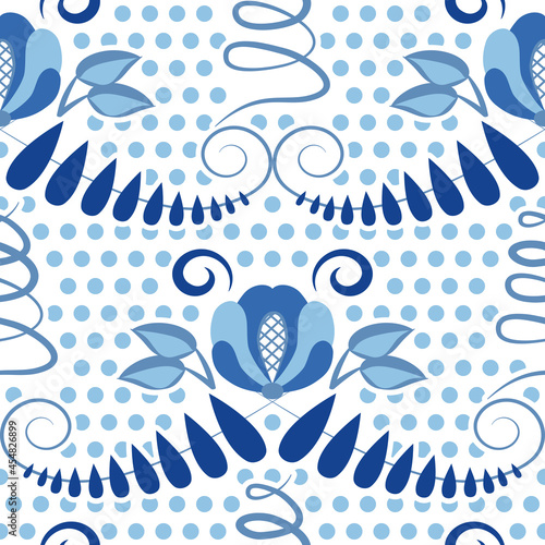Blue ethnic seamless pattern with flowers and polka dots. Background for the design in the style of traditional porcelain painting. Floral backdrop for fabric, wallpaper or wrapping paper