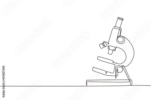 Single continuous line drawing simple microscope. Lab microscope to magnify bacteria size under the lens. Back to school minimalist, education concept. One line draw graphic design vector illustration