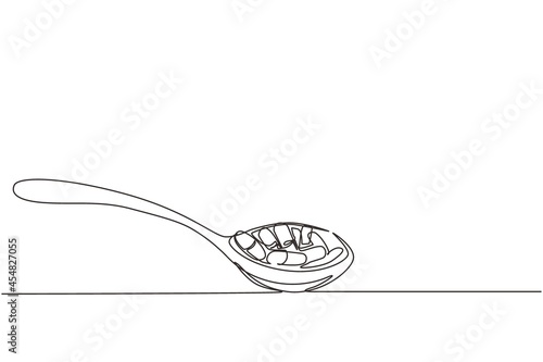 Single one line drawing herbal capsules on wooden spoon. Herbal medicine in capsules from sweet basil. Vitamin capsule in a wooden spoon. Modern continuous line draw design graphic vector illustration