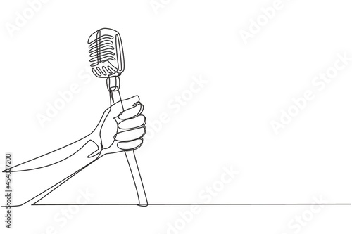Continuous one line drawing hand with a retro microphone. Vintage engraving stylized drawing. Karaoke man sings the song to old style microphone. Single line draw design vector graphic illustration