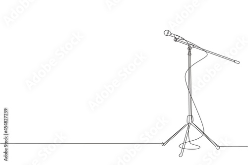 Single one line drawing microphone with cable on stand isolated on white background. Standing microphone on stage for sing competition. Modern continuous line draw design graphic vector illustration