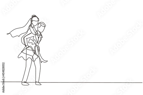 Fototapeta Naklejka Na Ścianę i Meble -  Single one line drawing cute married couple with man wearing suit carrying woman with wedding dress on his back. Happy romantic couple in love. Continuous line draw design graphic vector illustration