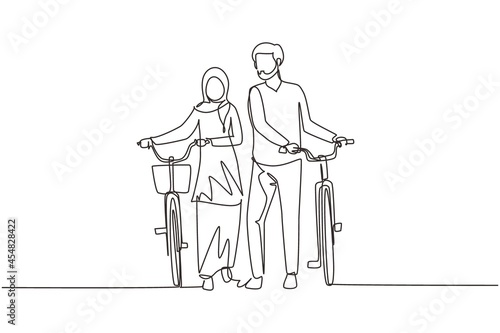 Single continuous line drawing cyclists walking down forest road with their bicycles on summer day. Young Arab man and woman in love. Happy romantic married couple. One line draw graphic design vector