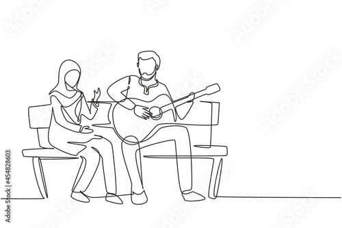 Single continuous line drawing Arabian people sitting on wooden bench in park. Couple on date  man playing music on guitar  girl listen and singing together. One line draw graphic vector illustration
