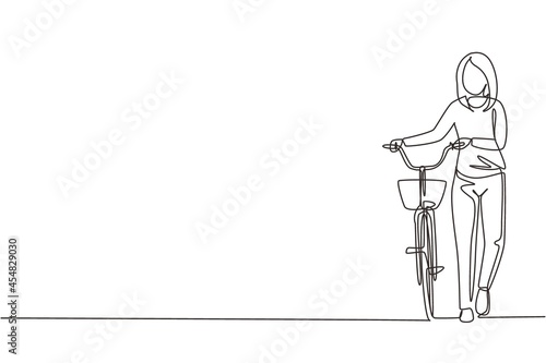 Single one line drawing walking young female with bicycles. Happy woman take walk with bicycle at city road. Healthy lifestyle of urban people. Continuous line draw design graphic vector illustration