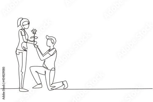 Single one line drawing man on knee gives flowers to woman. Young guy giving to girl rose flower for propose her. Happy romantic couple in love. Continuous line draw design graphic vector illustration
