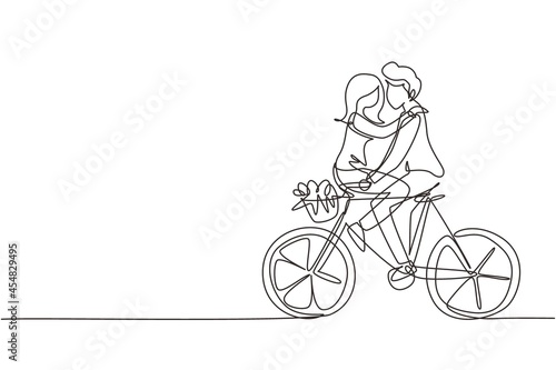 Fototapeta Naklejka Na Ścianę i Meble -  Continuous one line drawing happy young man and woman riding bicycle face to face. Happy romantic couple is riding bicycle together. Happy family. Single line draw design vector graphic illustration