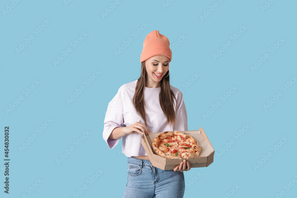 Beautiful young woman with tasty pizza on color background Beautiful young woman with tasty pizza on color background