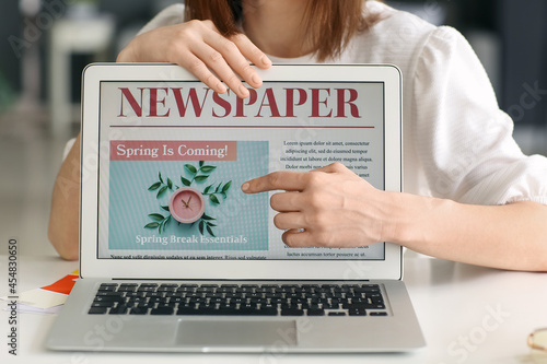 Young woman with open page ...