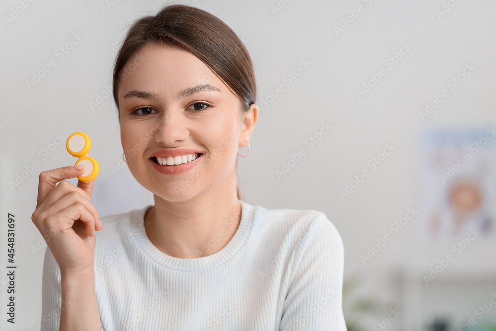 Young woman with contact lenses at ophthalmologist's office Young woman with contact lenses at ophthalmologist's office