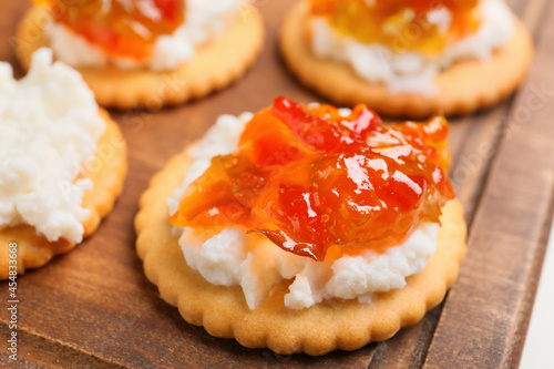 Delicious cracker with cottage cheese and jalapeno pepper jam, closeup photo