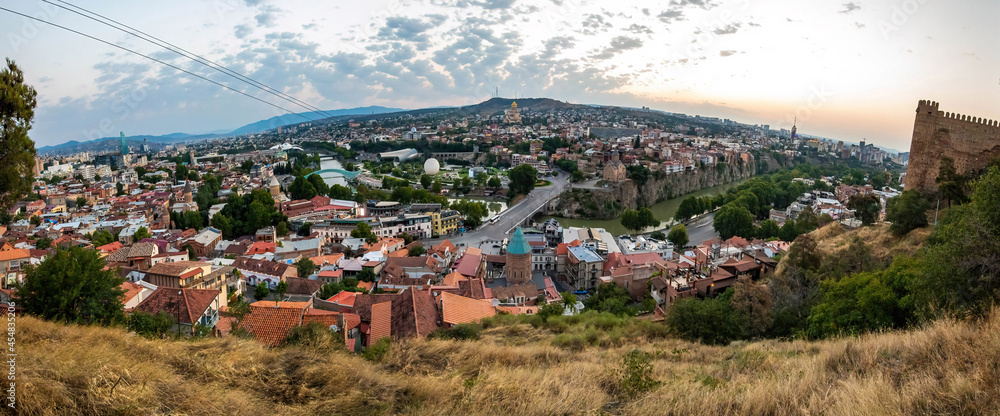Aerial panoramic view of Tbilisi city center at summer sunrise