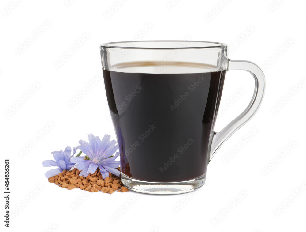 Glass cup of delicious chicory drink, granules and flowers on white background Glass cup of delicious chicory drink, granules and flowers on white background