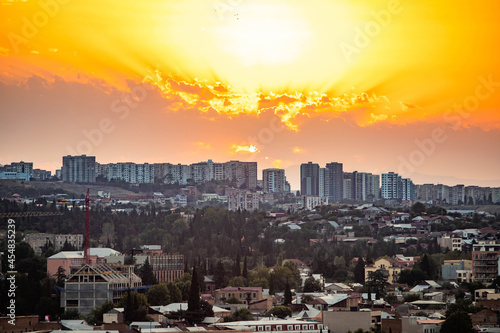 Aerial panoramic view of Tbilisi city center at summer sunrise